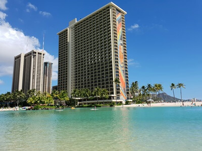 The turquoise lagoon just in front of the main Hilton Hawaiian Village tower that overlooks the Pacific ocean.